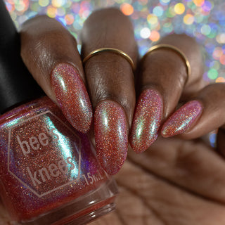 Image provided for Bee's Knees by a paid swatcher featuring the nail polish " The Crimson Moth "
