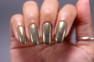 Image provided for Bee's Knees by a paid swatcher featuring the nail polish " Denial "