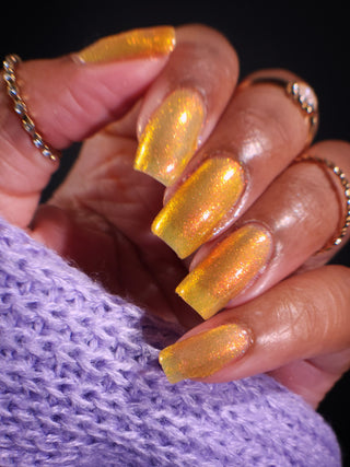 Image provided for Bee's Knees by a paid swatcher featuring the nail polish " Sunbird "