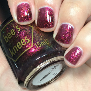 Image provided for Bee's Knees by a paid swatcher featuring the nail polish " Immutable "