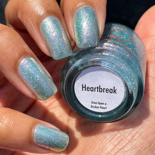 Image provided for Bee's Knees by a paid swatcher featuring the nail polish " Heartbreak "