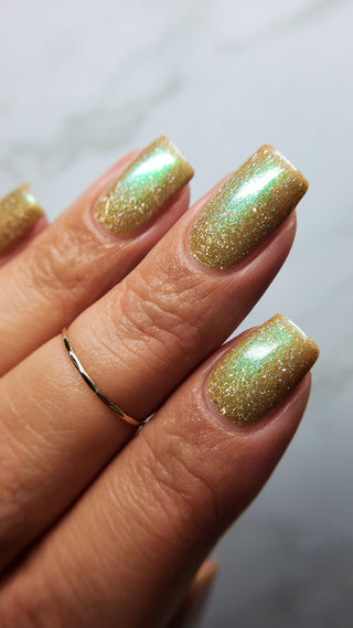 Image provided for Bee's Knees by a paid swatcher featuring the nail polish " Chaos "