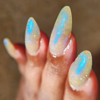 Image provided for Bee's Knees by a paid swatcher featuring the nail polish " All Bite "