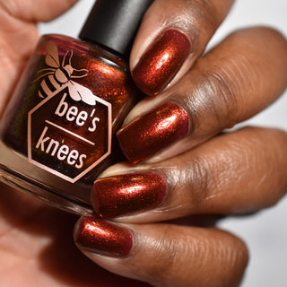Image provided for Bee's Knees by a paid swatcher featuring the nail polish " The Dark Angel "