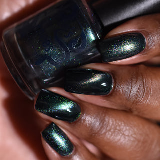 Image provided for Bee's Knees by a paid swatcher featuring the nail polish " Midnight Yoga and Seaweed "