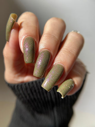 Image provided for Bee's Knees by a paid swatcher featuring the nail polish " Boil Beetle Venom "