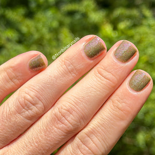 Image provided for Bee's Knees by a paid swatcher featuring the nail polish " Boil Beetle Venom "