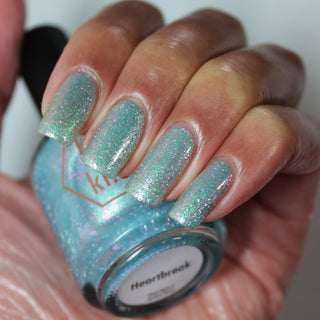 Image provided for Bee's Knees by a paid swatcher featuring the nail polish " Heartbreak "