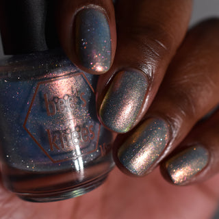 Image provided for Bee's Knees by a paid swatcher featuring the nail polish " The Archer's Curse "