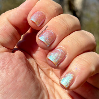 Image provided for Bee's Knees by a paid swatcher featuring the nail polish " Through Love, All is Possible "