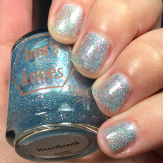 Image provided for Bee's Knees by a paid swatcher featuring the nail polish " Heartbreak "