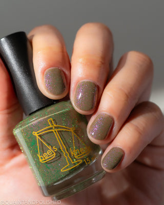 Image provided for Bee's Knees by a paid swatcher featuring the nail polish " Boil Beetle Venom "