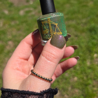 Image provided for Bee's Knees by a paid swatcher featuring the nail polish " Boil Beetle Venom "
