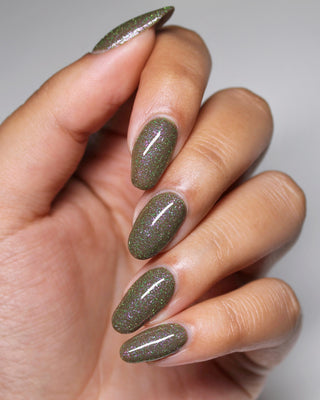 Image provided for Bee's Knees by a paid swatcher featuring the nail polish " Boil Beetle Venom "
