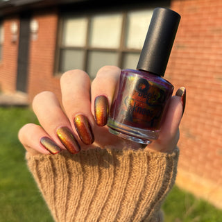 Image provided for Bee's Knees by a paid swatcher featuring the nail polish " The Bar is in Hell "