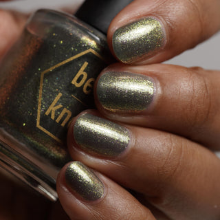 Image provided for Bee's Knees by a paid swatcher featuring the nail polish " Denial "