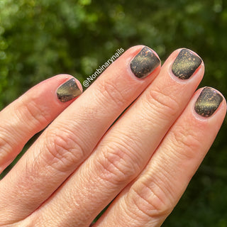 Image provided for Bee's Knees by a paid swatcher featuring the nail polish " Stormfall "