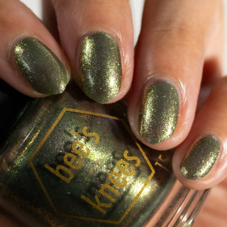 Image provided for Bee's Knees by a paid swatcher featuring the nail polish " Denial "