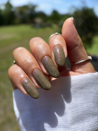 Image provided for Bee's Knees by a paid swatcher featuring the nail polish " Boil Beetle Venom "