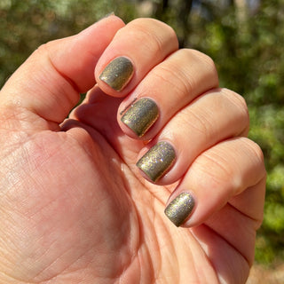 Image provided for Bee's Knees by a paid swatcher featuring the nail polish " Denial "