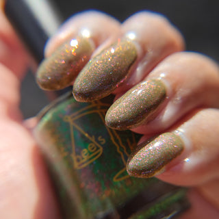 Image provided for Bee's Knees by a paid swatcher featuring the nail polish " Boil Beetle Venom "