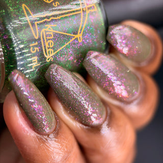 Image provided for Bee's Knees by a paid swatcher featuring the nail polish " Boil Beetle Venom "
