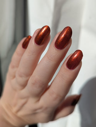 Image provided for Bee's Knees by a paid swatcher featuring the nail polish " The Dark Angel "