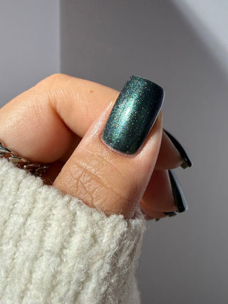 Image provided for Bee's Knees by a paid swatcher featuring the nail polish " Midnight Yoga and Seaweed "