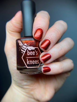 Image provided for Bee's Knees by a paid swatcher featuring the nail polish " The Dark Angel "