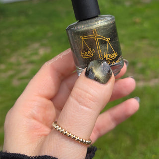 Image provided for Bee's Knees by a paid swatcher featuring the nail polish " Stormfall "