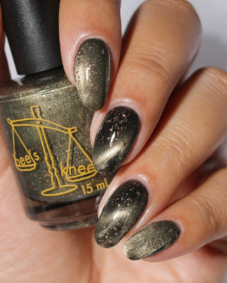 Image provided for Bee's Knees by a paid swatcher featuring the nail polish " Stormfall "