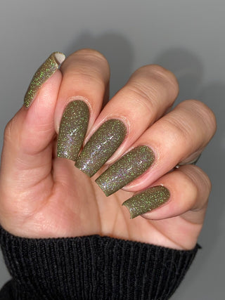 Image provided for Bee's Knees by a paid swatcher featuring the nail polish " Boil Beetle Venom "