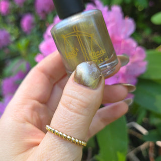 Image provided for Bee's Knees by a paid swatcher featuring the nail polish " Violentia nervus potestas "