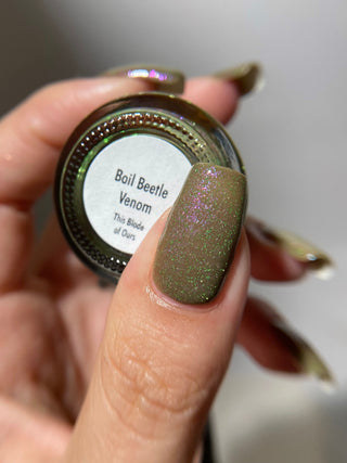 Image provided for Bee's Knees by a paid swatcher featuring the nail polish " Boil Beetle Venom "