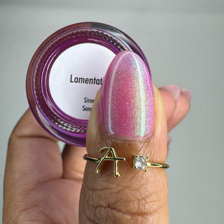 Image provided for Bee's Knees by a paid swatcher featuring the nail polish " Lamentation "