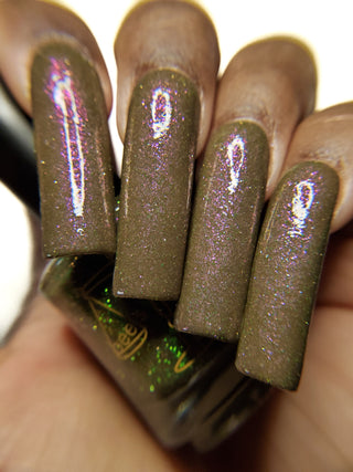 Image provided for Bee's Knees by a paid swatcher featuring the nail polish " Boil Beetle Venom "